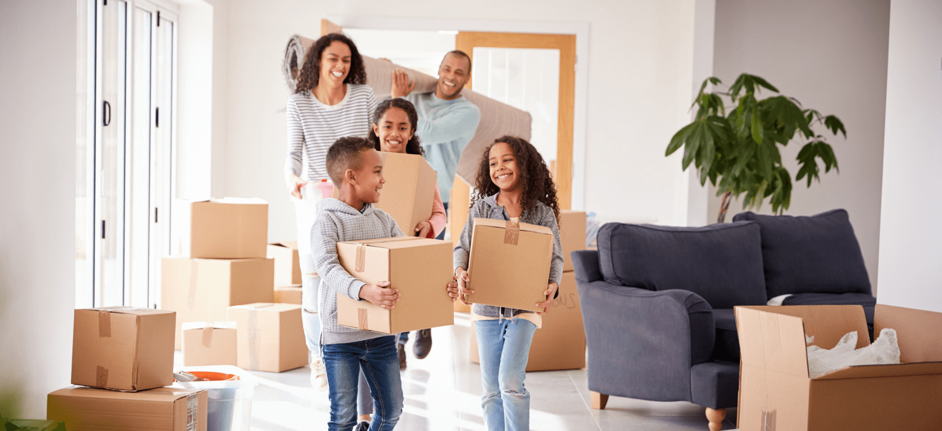 Happy family moving in to their new home thanks to Greene Light Home Loans